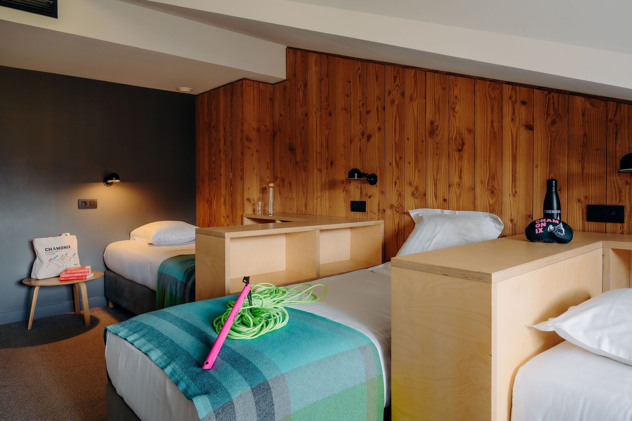 Comfortable relaxation area with sofa, blankets, cosy and relaxing atmosphere at PlanB Chamonix.