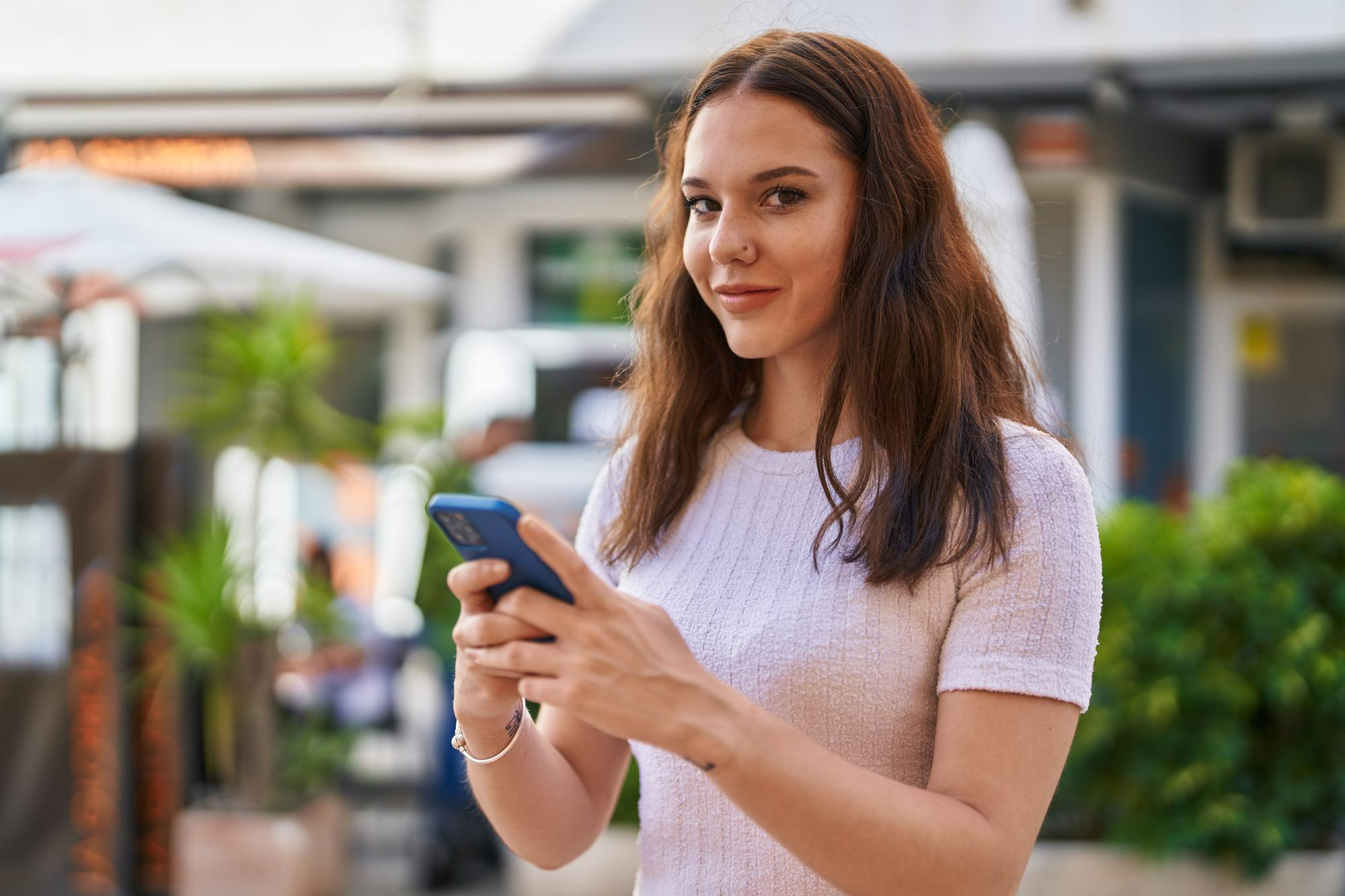 Behavioral health patient using a secure mobile app for treatment updates and confidential communication.