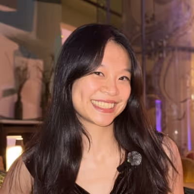 A portrait of smiling Kelly Chung - founder of Amlifier Effect collective for women