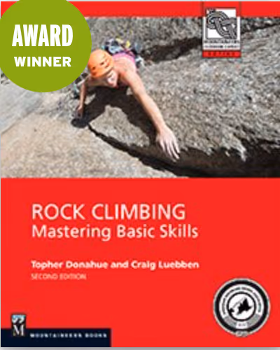 Person climbing a rocky surface with safety gear, featured on a rock climbing instructional book cover.