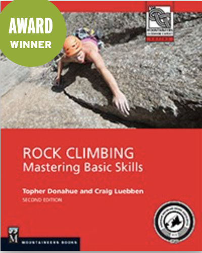 Person climbing a rocky surface with safety gear, featured on a rock climbing instructional book cover.