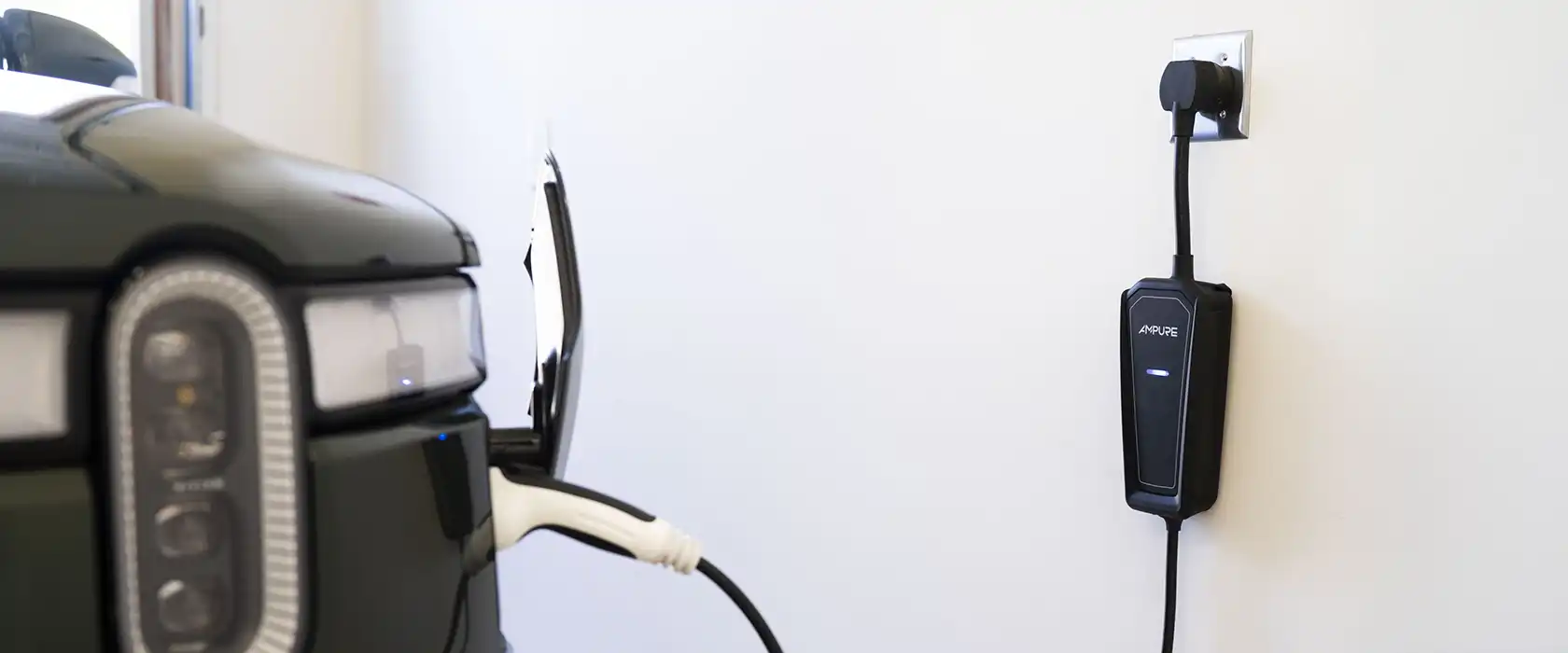 Ampure Go in Black Charging SAE Rivian EV