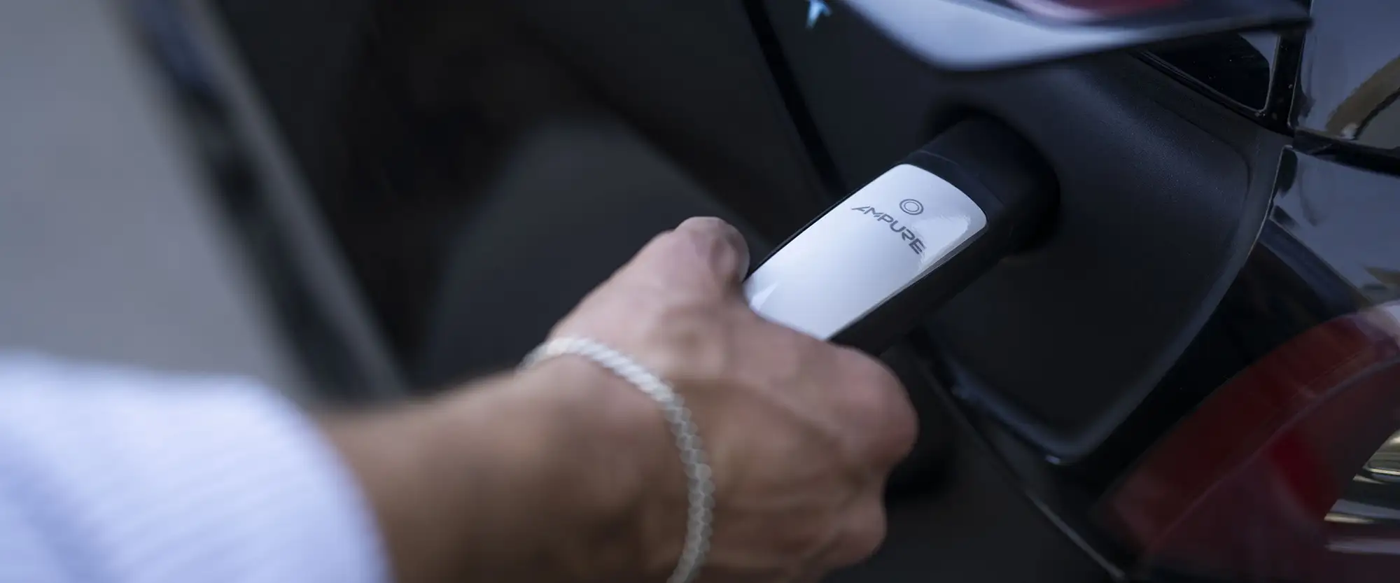 Ampure Go 2 Portable EV Charger NACS charging an Tesla