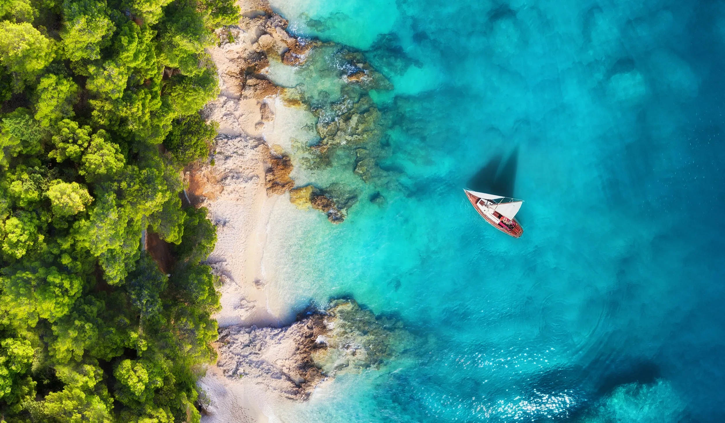 An aerial view of a boat on the water