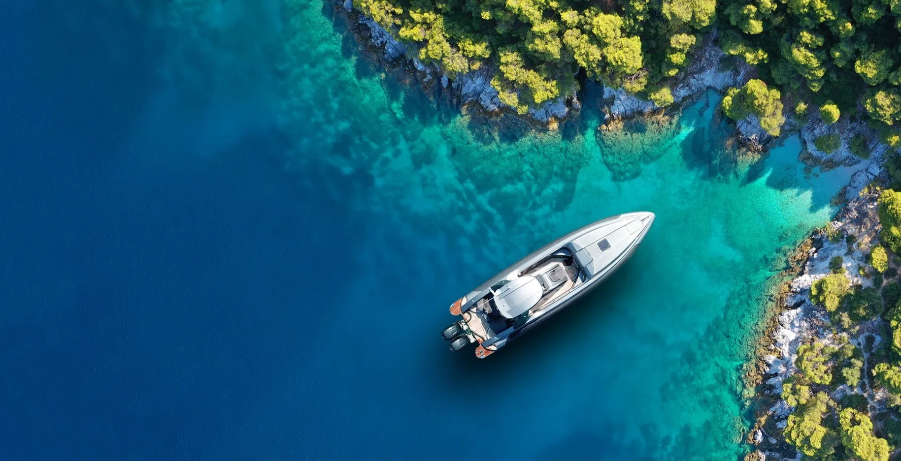 A boat floating in the middle of a body of water