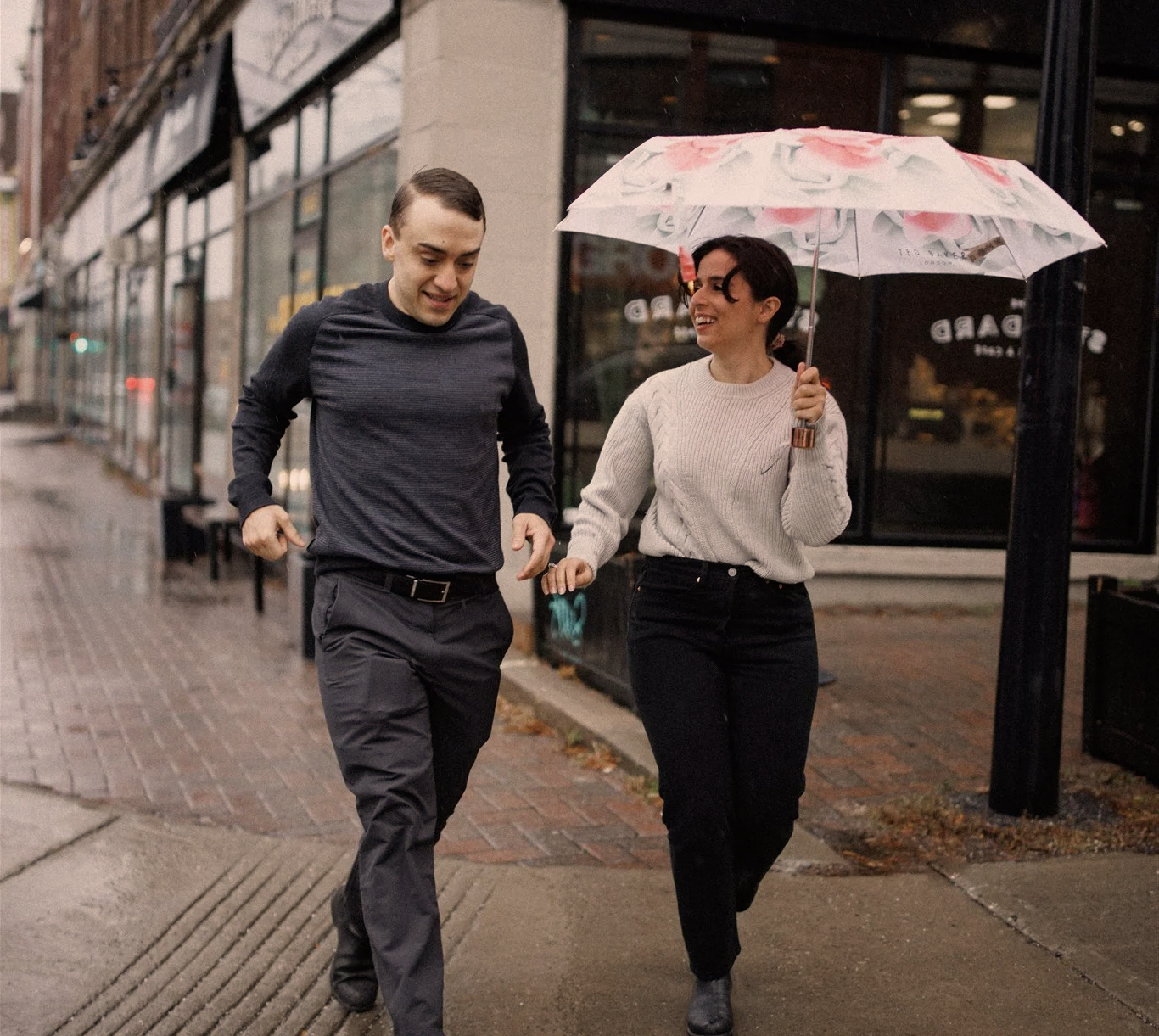Tamar and Geoff walking in the rain