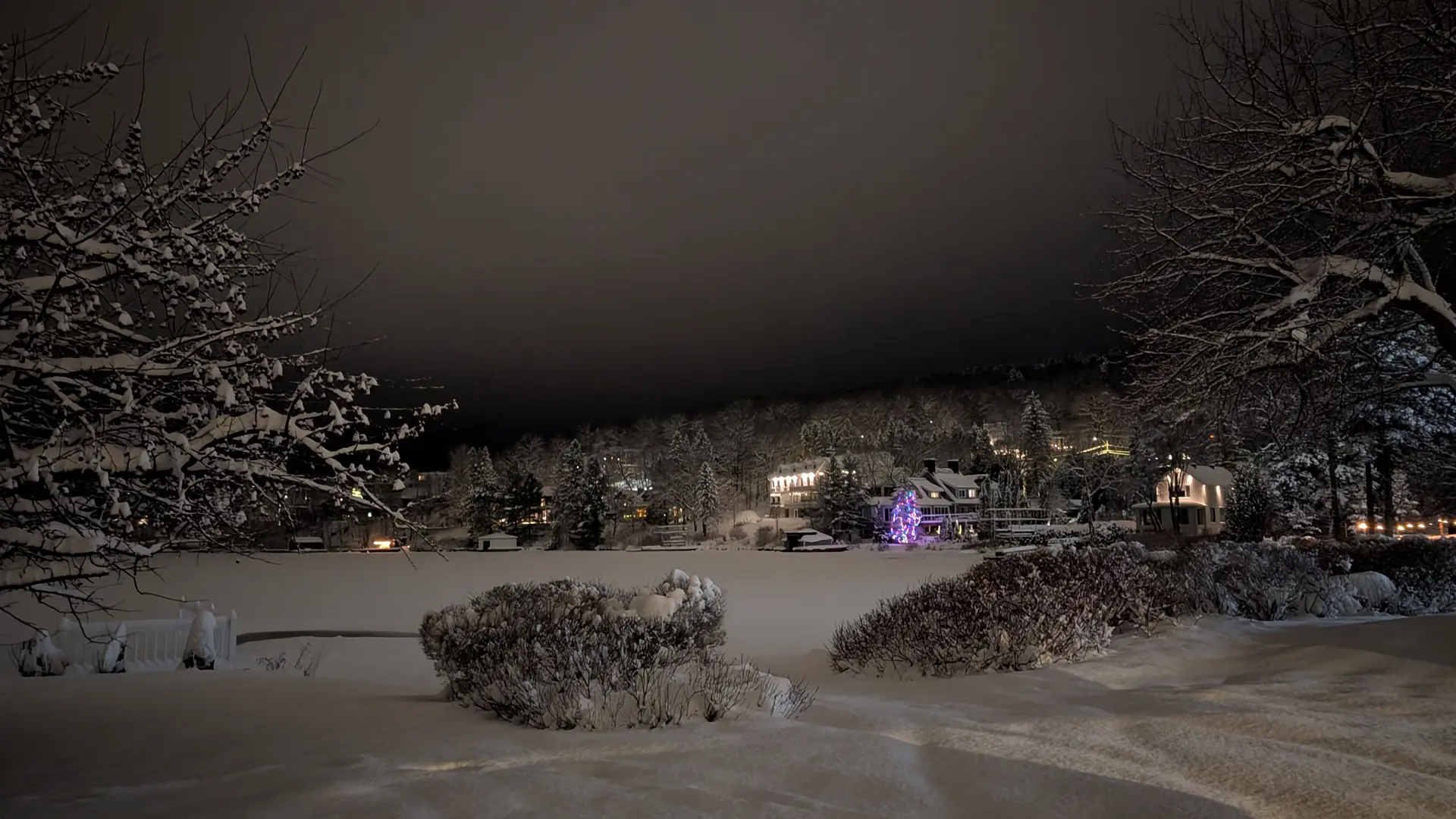 entourage resort lake view at night with lots of snow