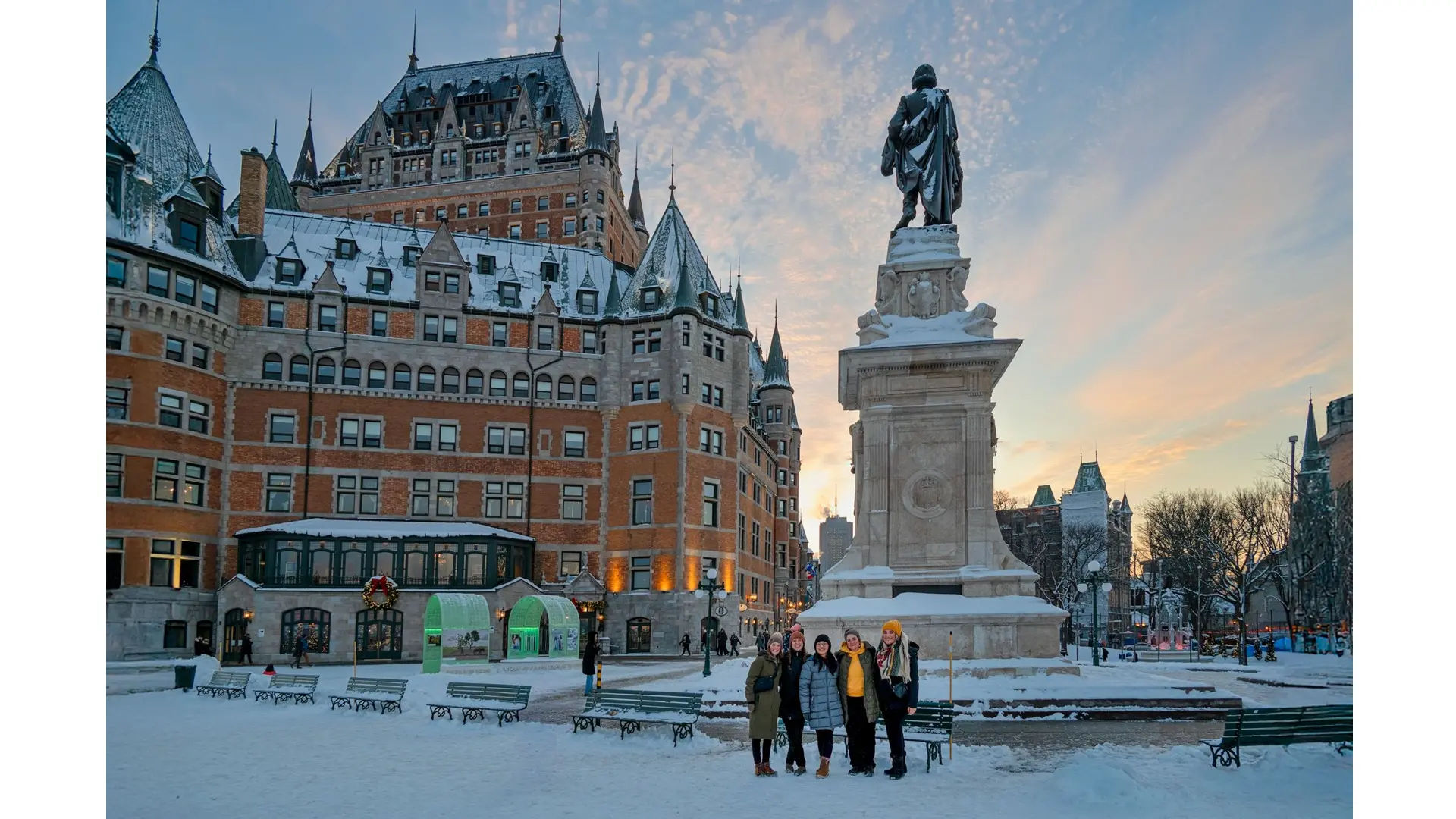 selly nia with a few of adventure canada employees in front of the iconic frontenac hotel in quebec