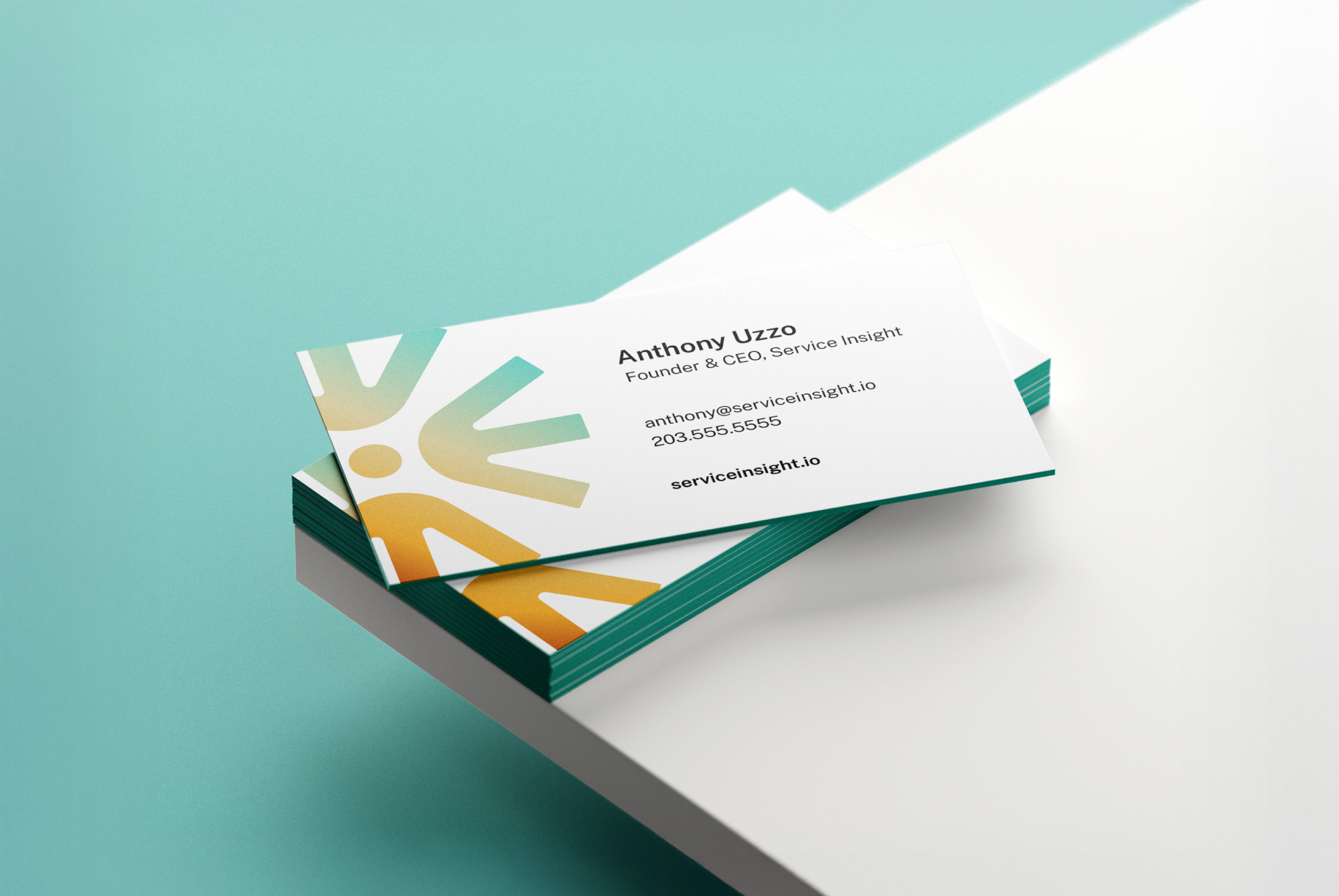 Stack of business cards with a teal and orange abstract logo, showing contact details for Anthony Uzzo, Founder & CEO of Service Insight.