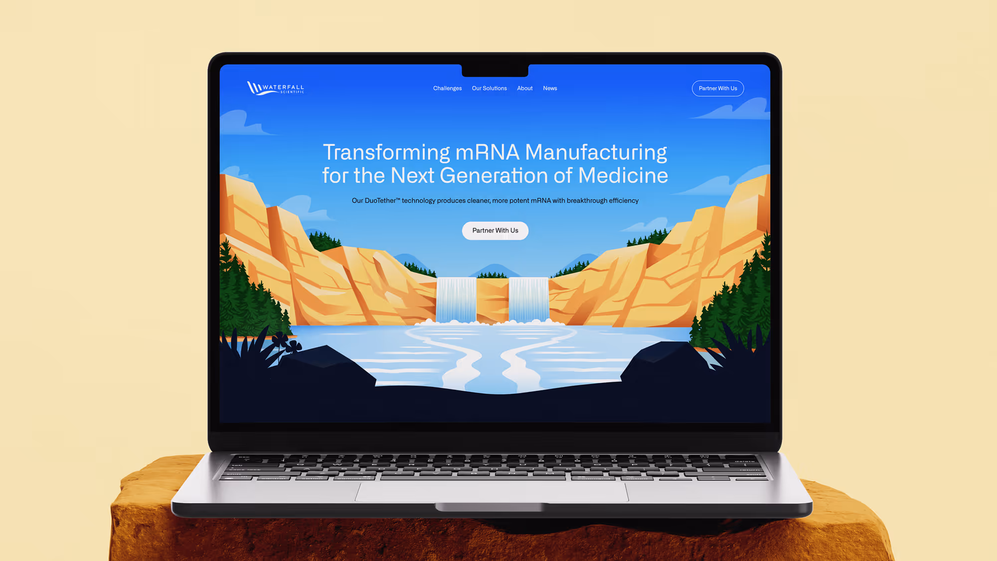 Laptop displaying Waterfall Scientific website with a vibrant illustration of waterfalls, cliffs, and trees and the text about transforming mRNA manufacturing.