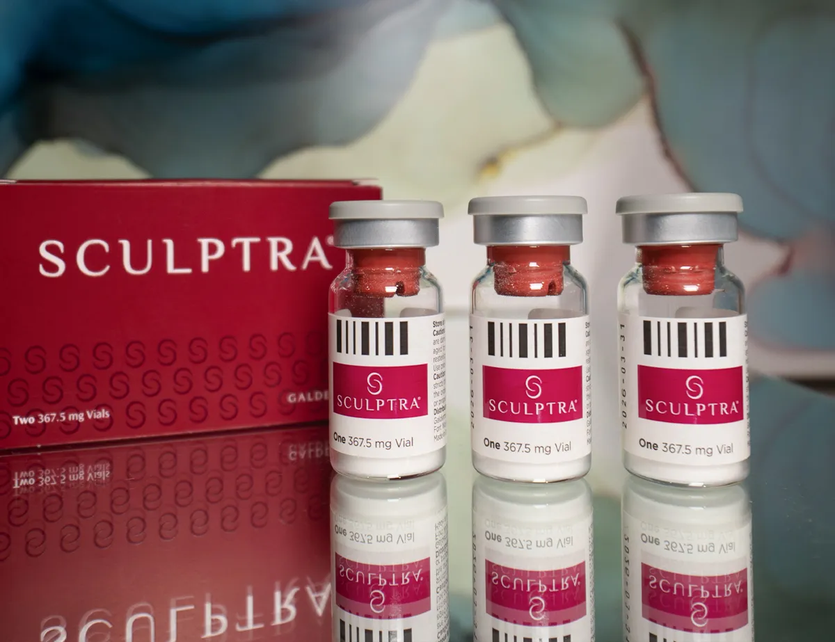Table with 3 vials of Sculptra on it at SOM Aesthetics in San Diego