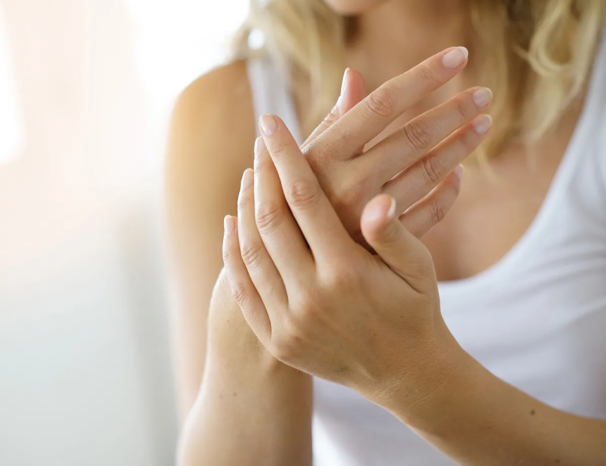 Female patient hands with lines before filler treatment in San Diego