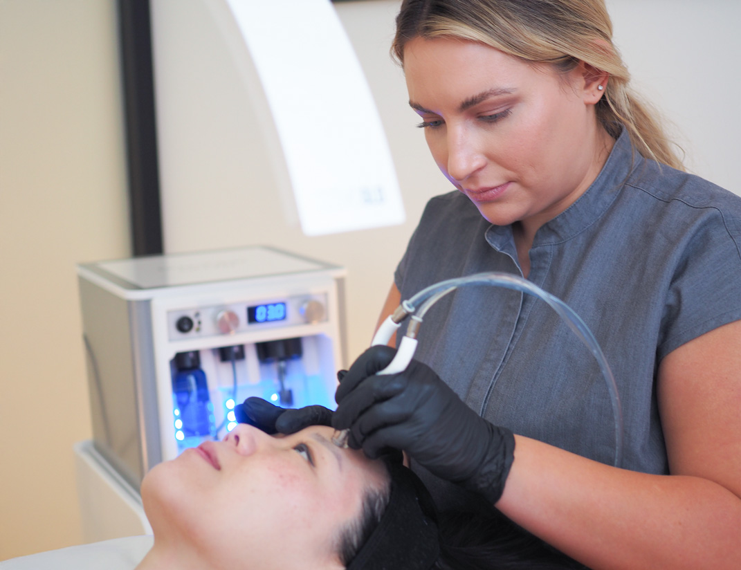 Woman receiving facial in San Diego