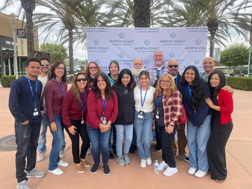 A group of people smiling
