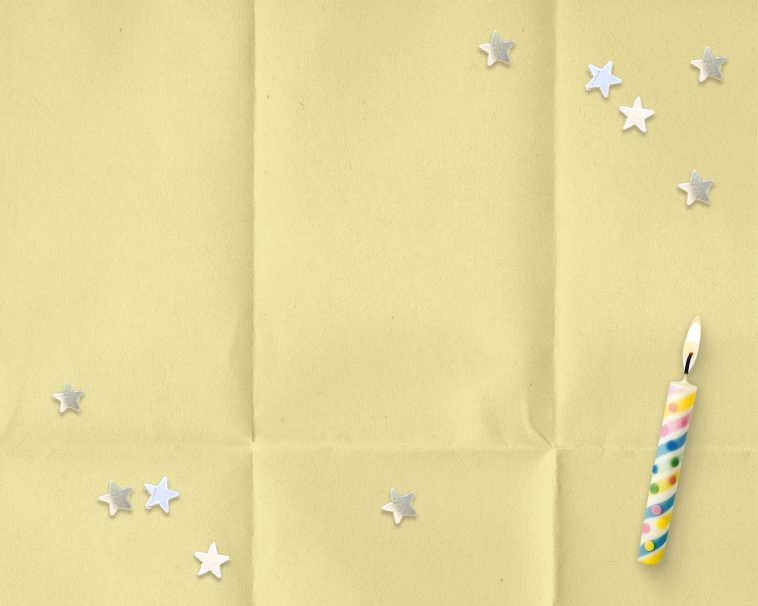 A yellow paper textured background with silver star sparkles, birthday candles. 
