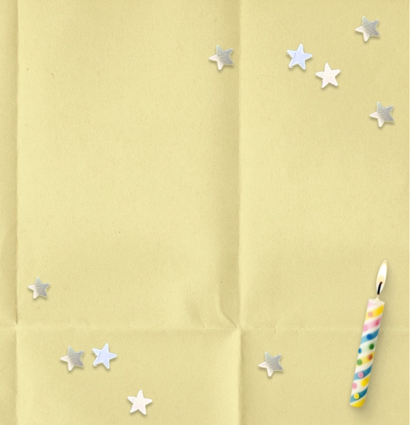 A yellow paper textured background with silver star sparkles, birthday candles. 
