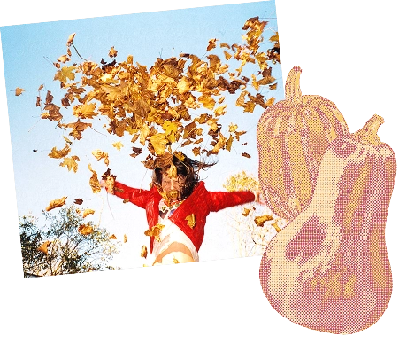 Person wearing a red jacket joyfully throwing a large bunch of autumn leaves into the air outdoors against a clear blue sky.