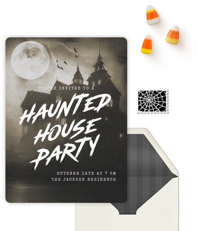 Invitation card for a haunted house party with a spooky mansion under a full moon and flying bats, accompanied by three candy corns and a black-and-white spider web stamp, with a partially open envelope.