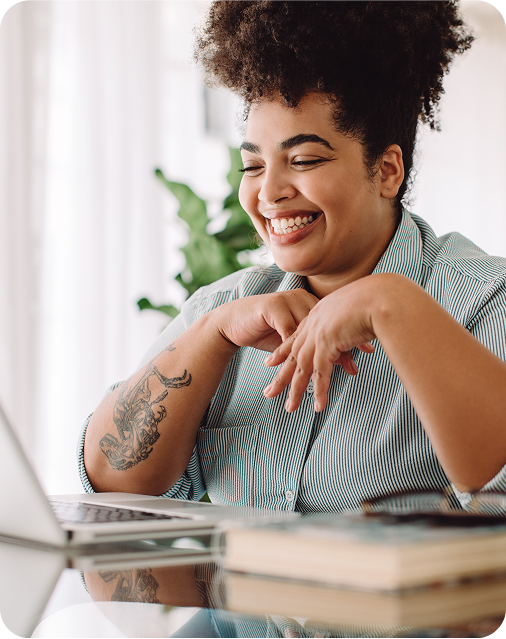 Smiling young black woman on a video conference call