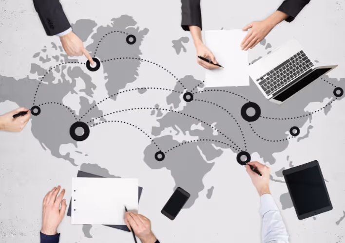 Global collaboration concept with hands pointing at a world map