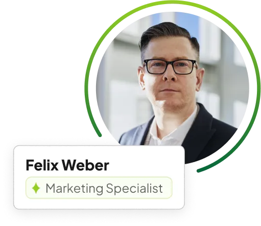 A man with glasses and a name tag in front of him.