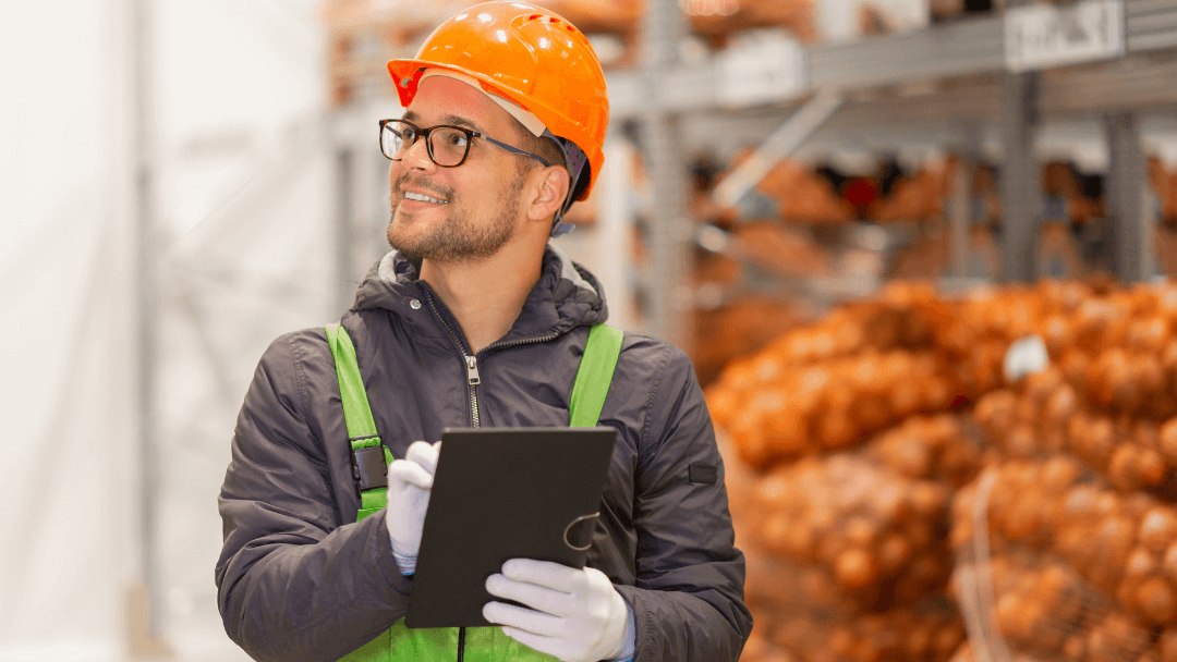 Worker using order management software in the warehouse
