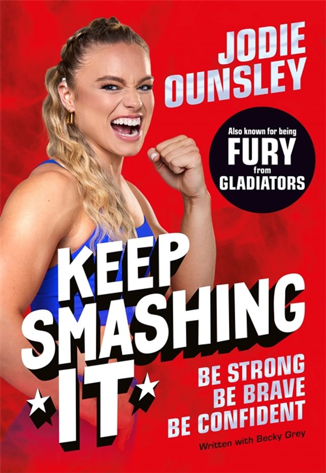 Keep Smashing It book cover: Jodie Ounsley grins and raises a fist against a bright red background, with the title in large white letters