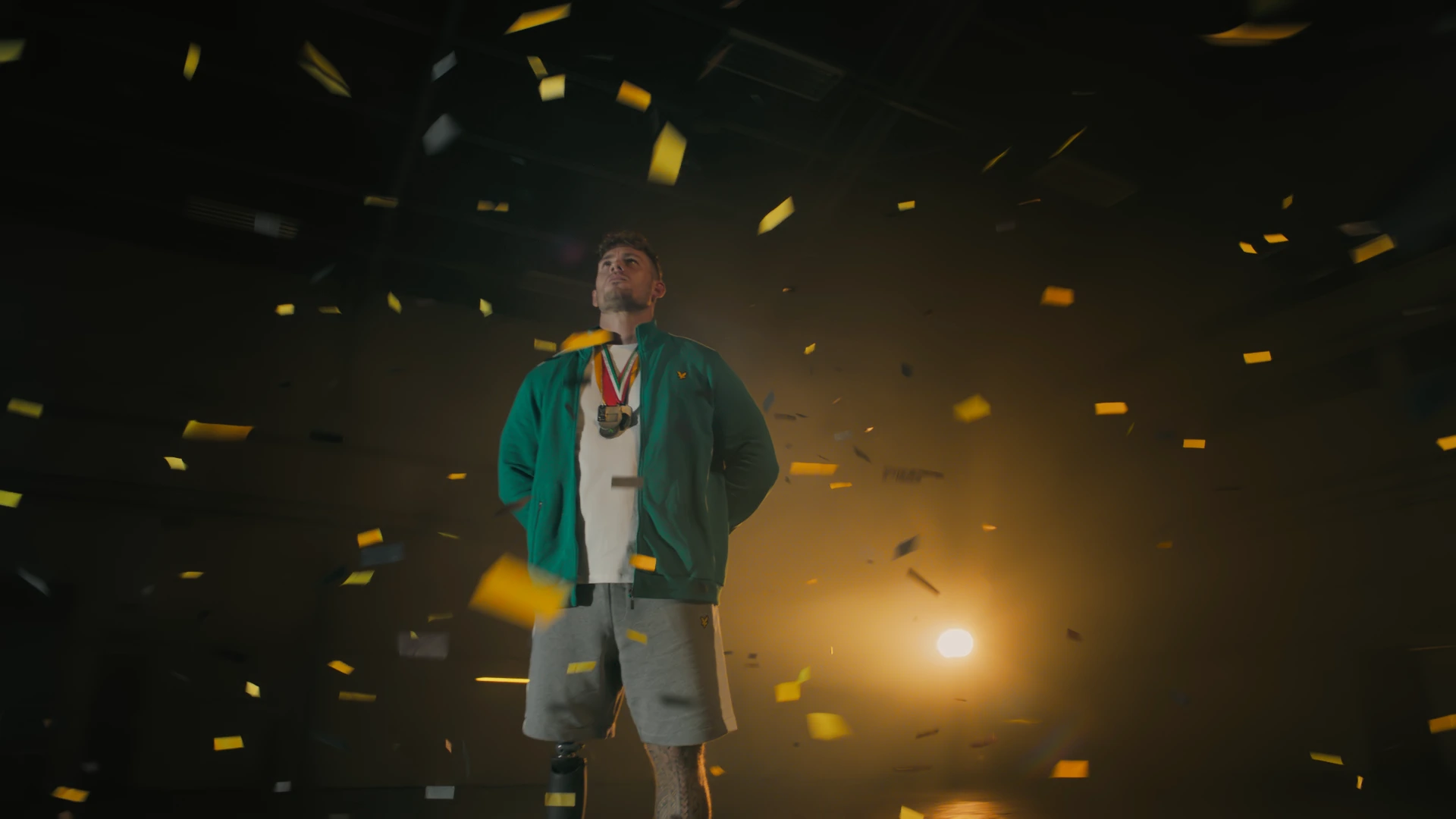 Man stood among confetti in Lyle & Scott ad
