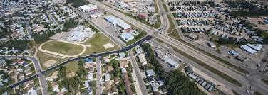 Aerial view of Edson with a highway intersection, commercial buildings, and surrounding residential neighborhoods.