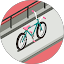 Teal and pink bicycle on a path beside a railing