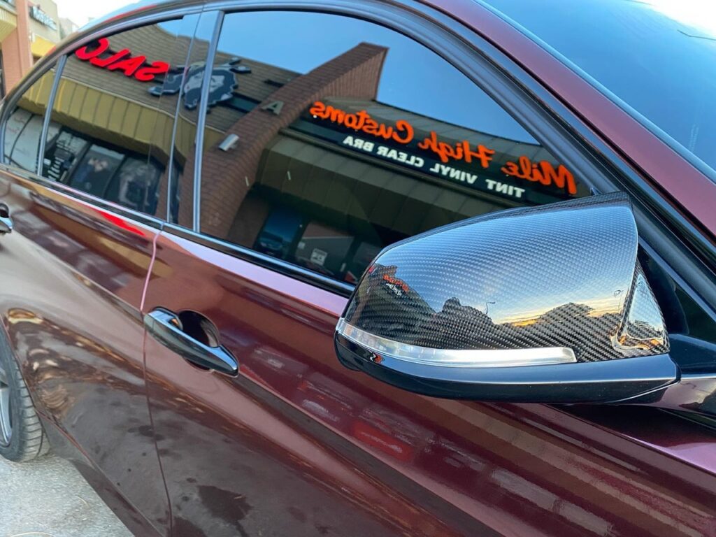 BMW 335i window tint side view, Mile High Customs logo reflection