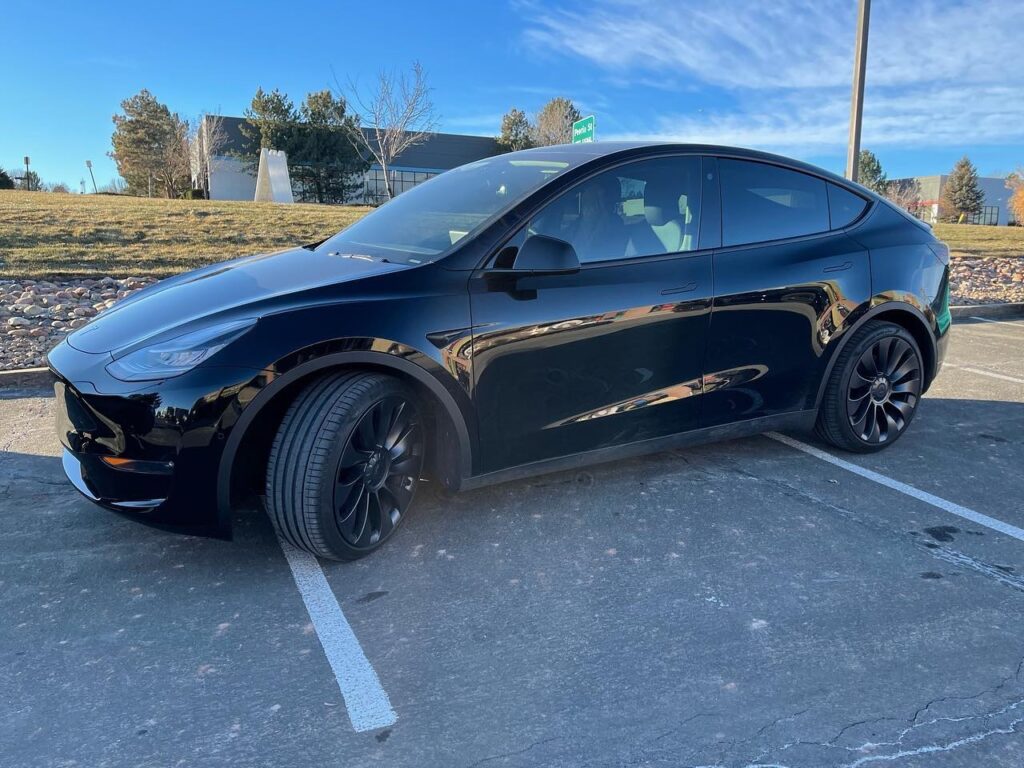 black Tesla Model Y 2 front windows tinted side view