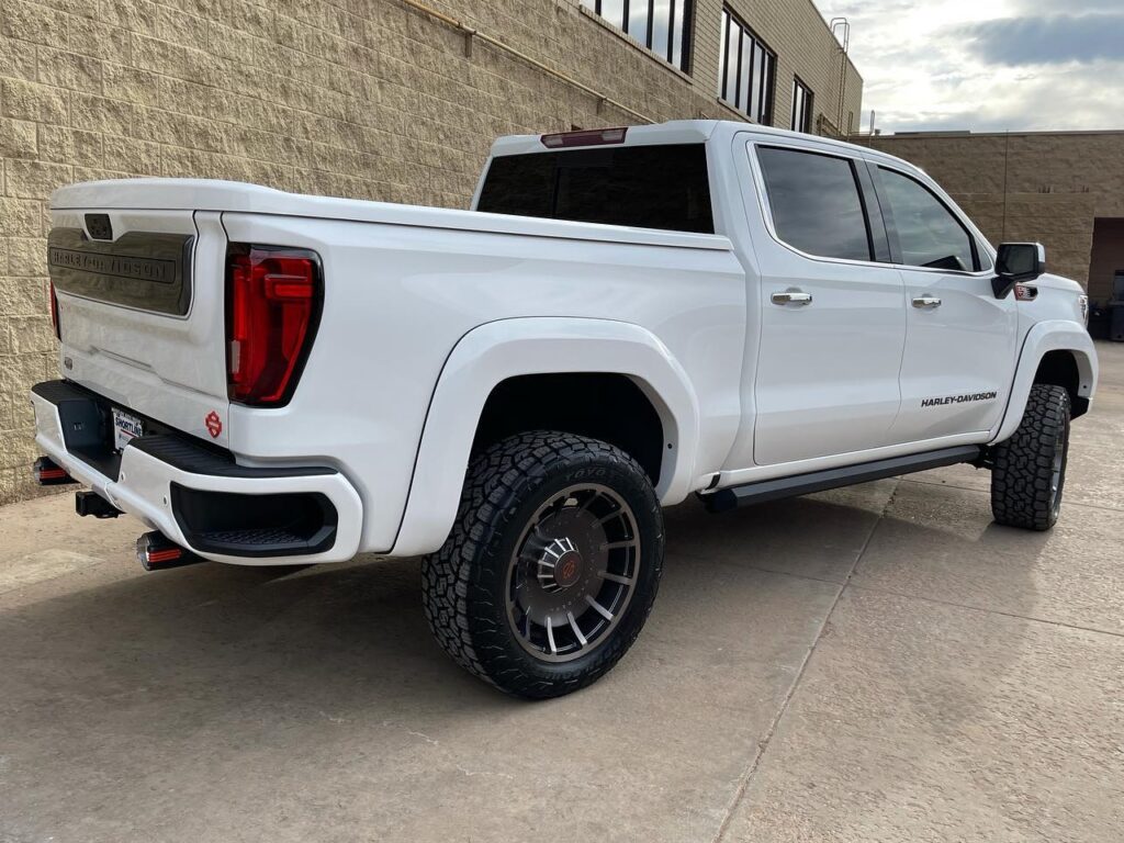 Brand new white GMC Harley truck getting paint corrected and ceramic coated, back view