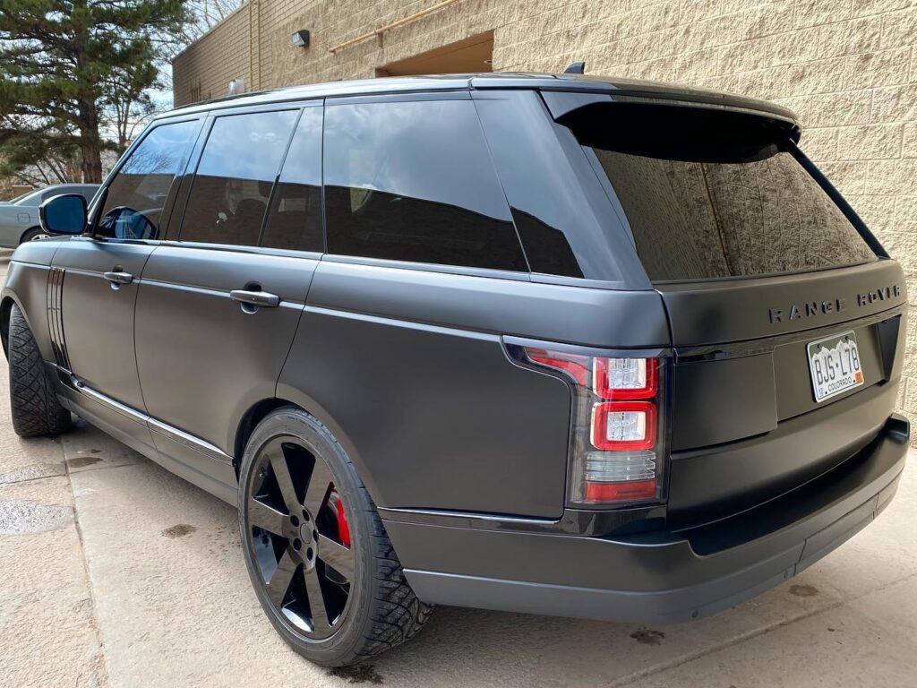 Range Rover blacked out. Satin black vinyl wrap, gloss black trim, powder coated wheels. Side view