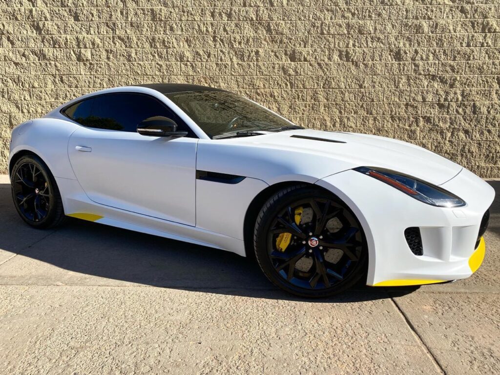 Jaguar F-Type in for a new color! vinyl wrap in satin white along with satin yellow and carbon fiber accents! We also topped it off with our ceramic coating to make it easier to clean and maintain!