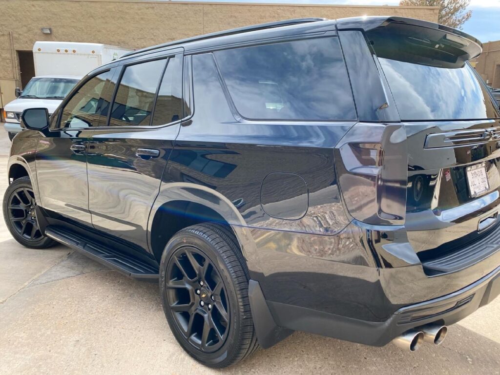 Chevy Tahoe ceramic plus window tint, chrome trim painted gloss black, 7 year ceramic coating, Smoked out taillights