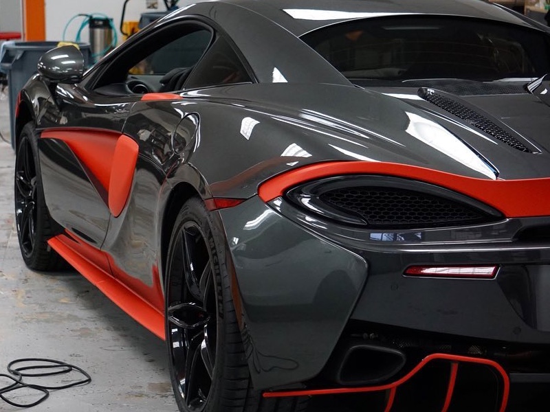 Mclaren 570s with matte red accents back view