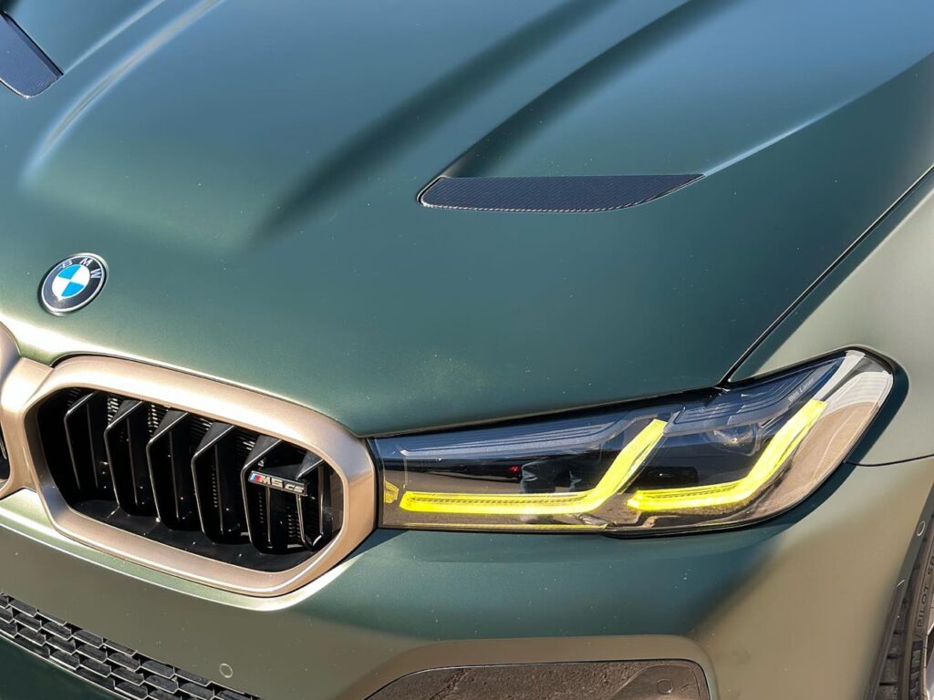 Close-up view of the BMW M5 CS showcasing the reflective gleam of the ceramic coating.