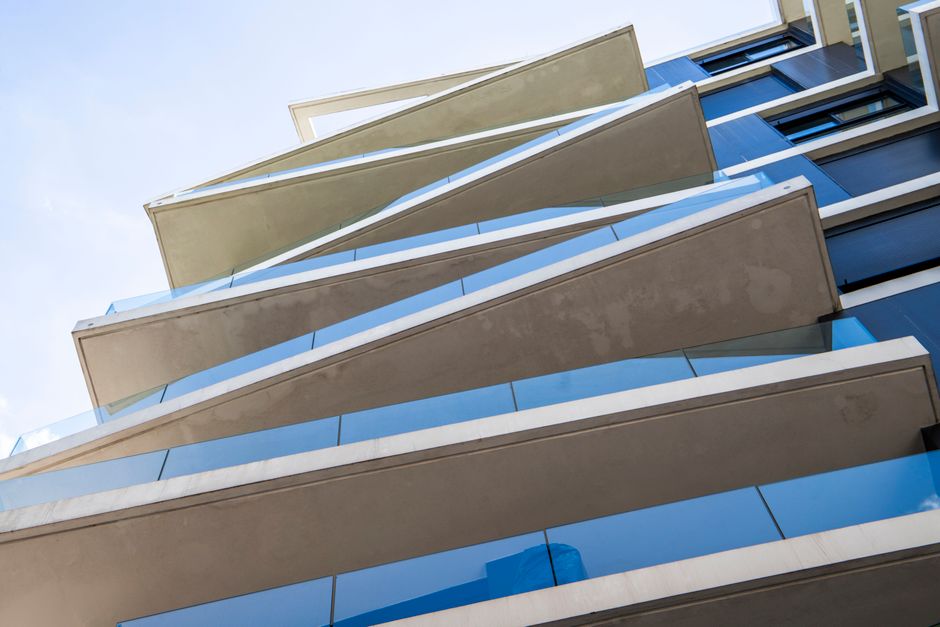Low-angle view of a modern building with geometric balconies in Montevideo.