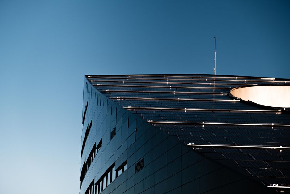 Low angle shot of a modern building with solar panels in Trondheim, Norway.