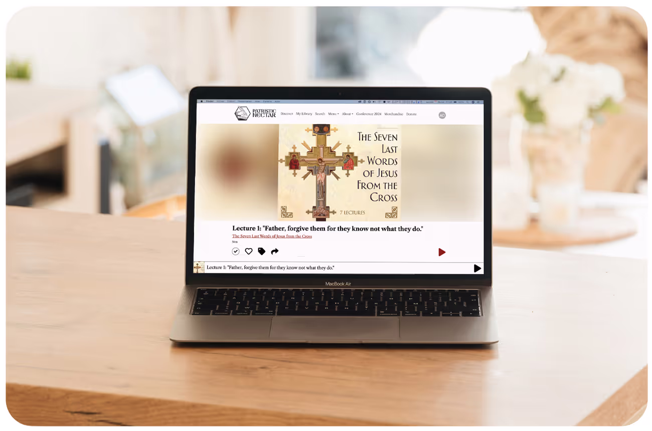 A laptop displaying content on Patristic Nectar's app using the Annunciate platform