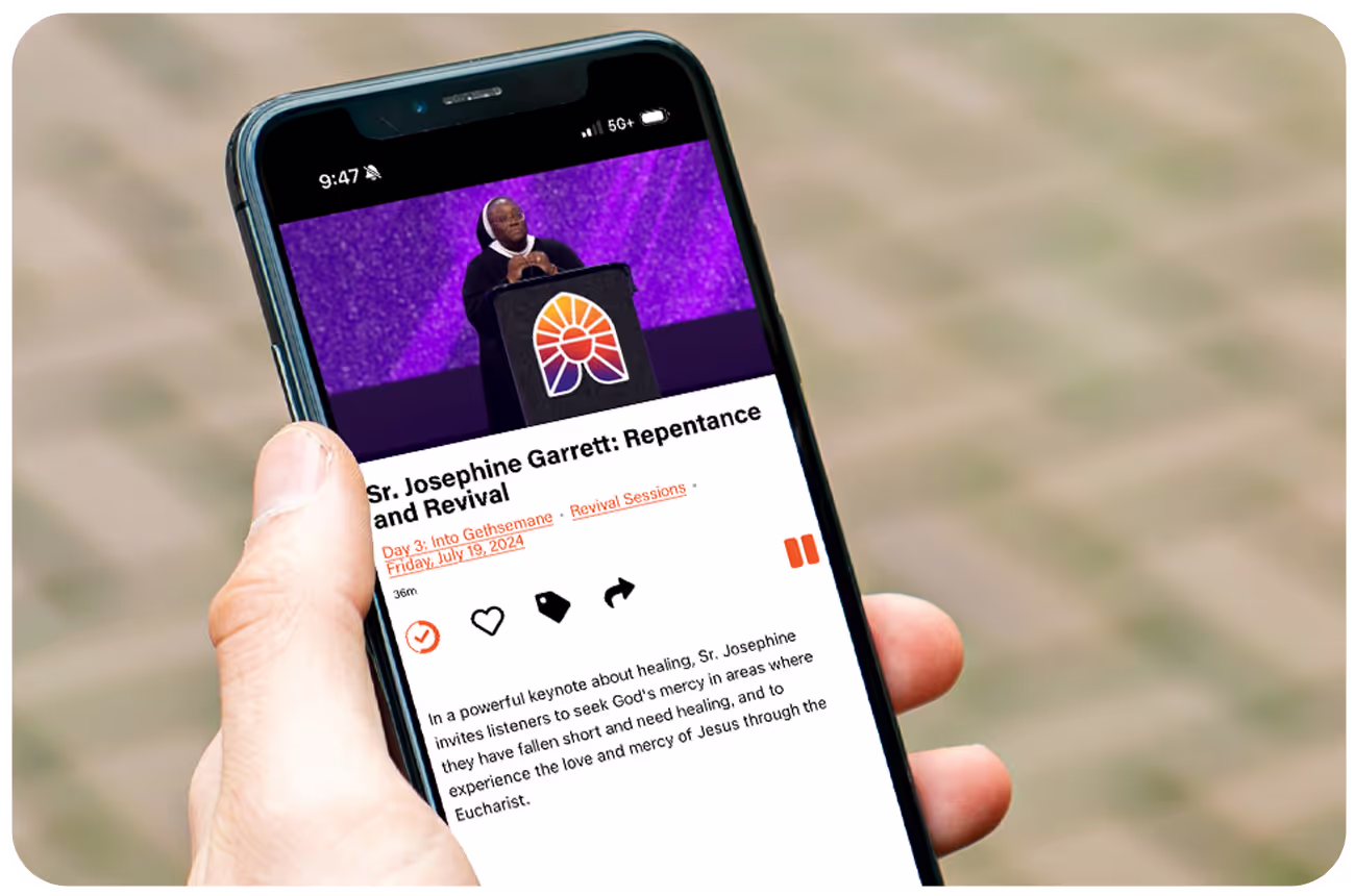 A person watching a talk from the Eucharistic Congress on an app built with Annunciate's platform