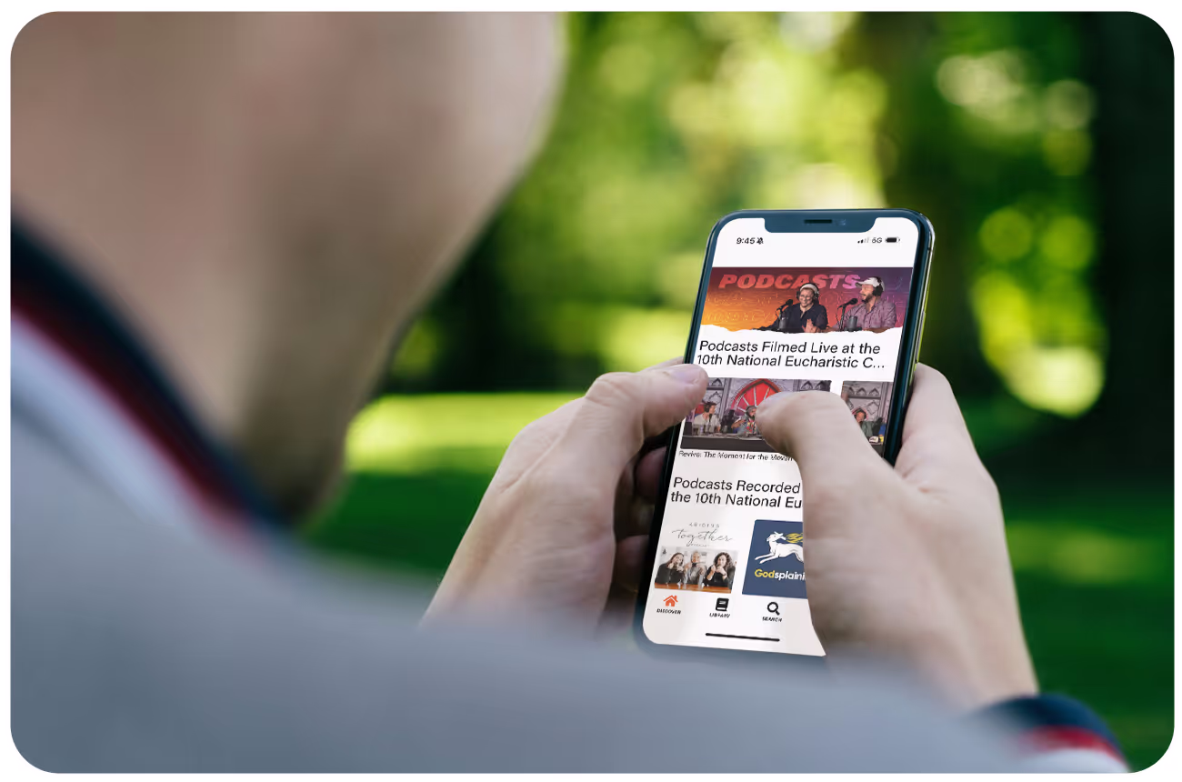 Close-up of someone using their phone to use the National Eucharistic Congress app on Annunciate