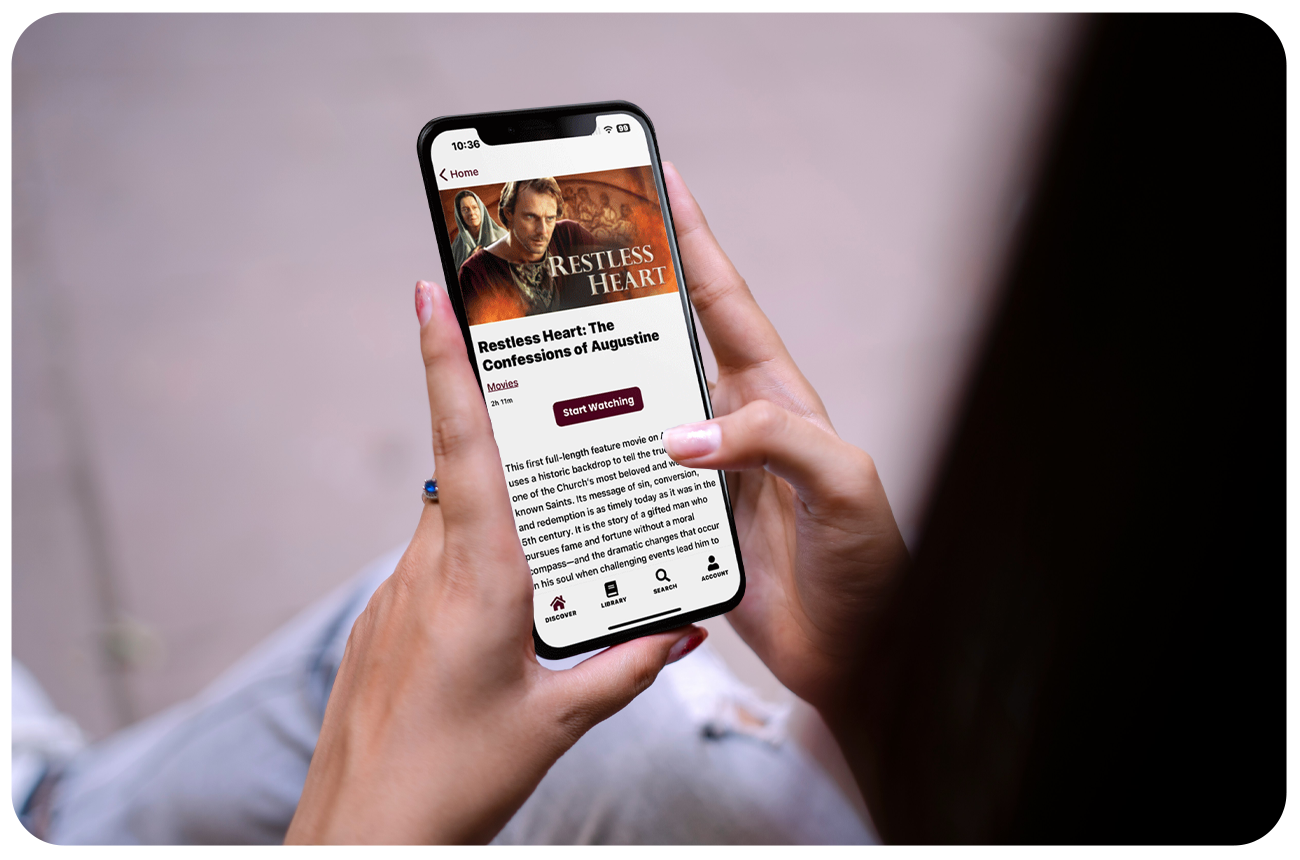 Woman watching a movie on the Ignatius Press app using Annunciate