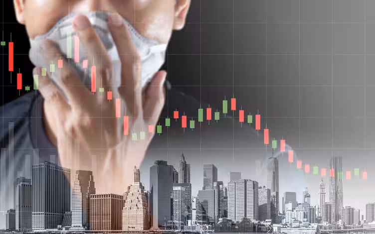 A person wearing a face mask, overlaid with a declining stock market chart and a city skyline, illustrating economic impact of a health crisis.