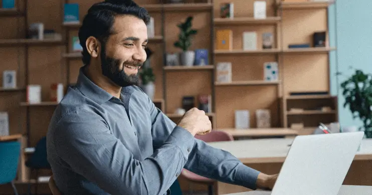 a man seated at his desk.