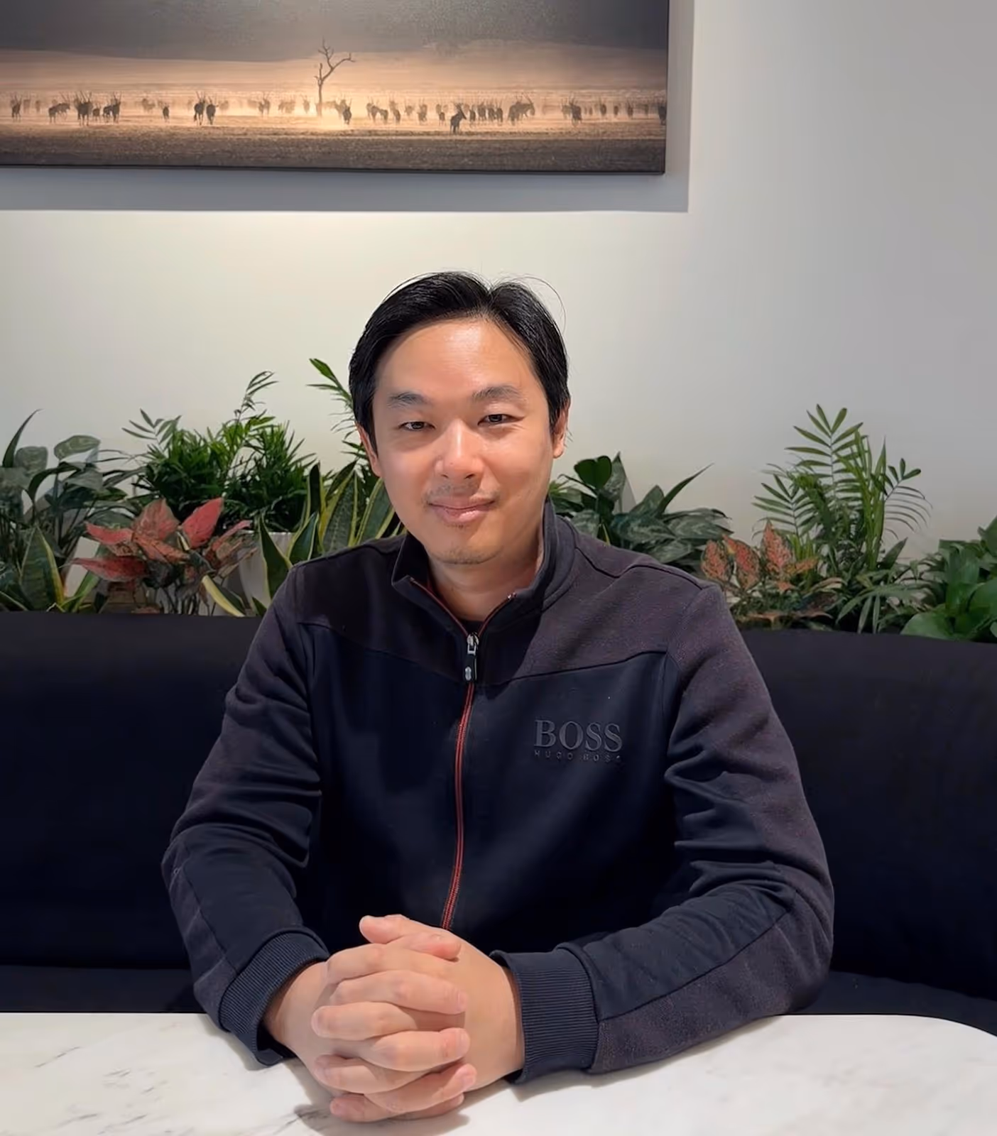 A person sitting at a tableDescription automatically generated