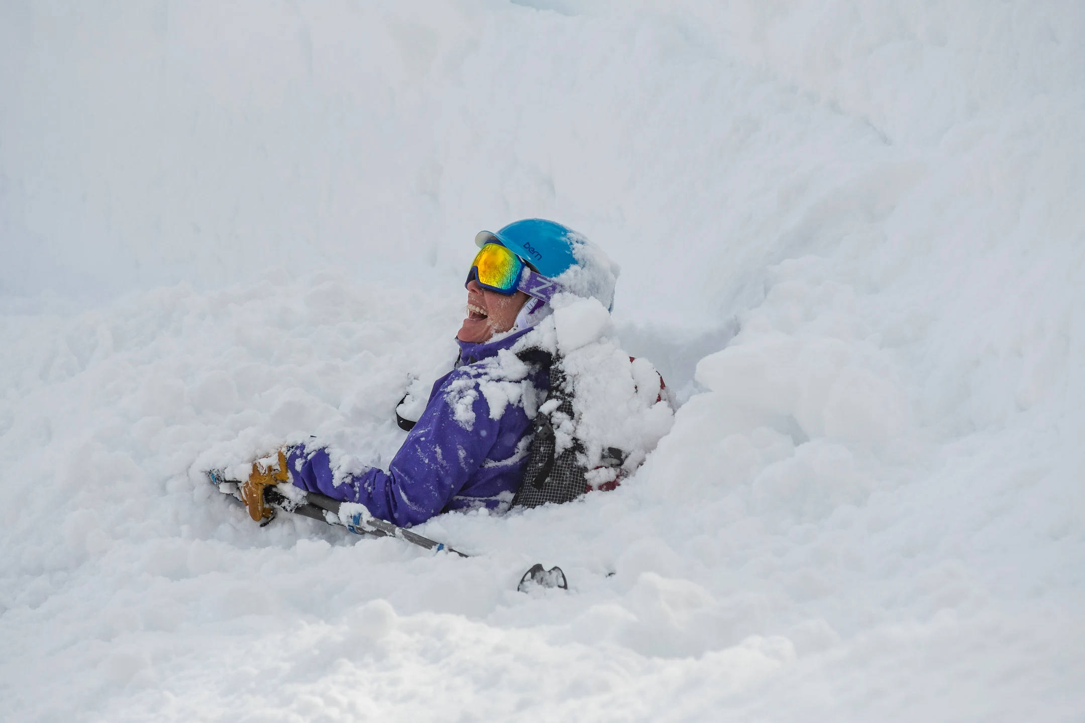 Women laughing, haven fallen in deep snow