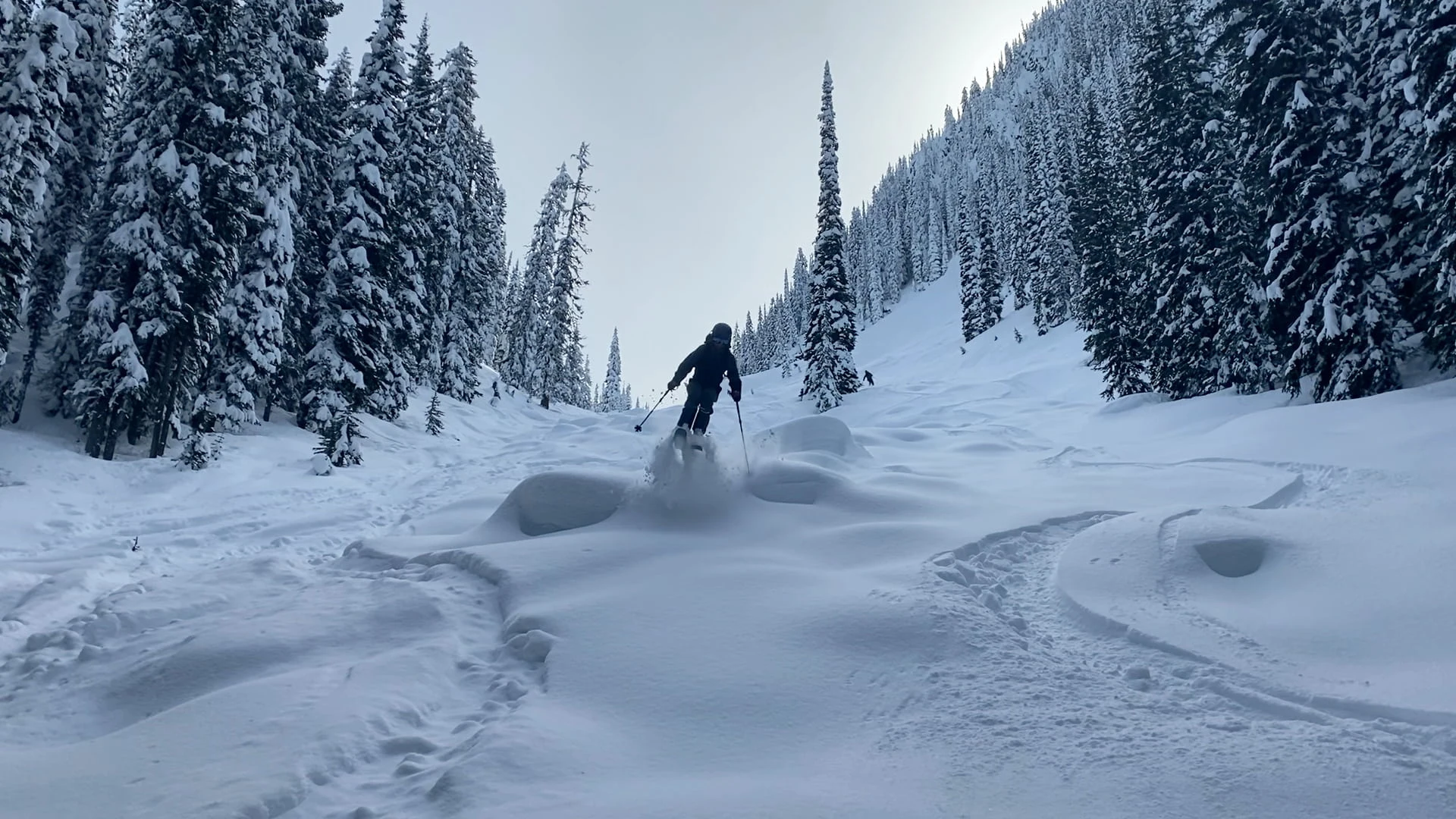 Backcountry skier gets air off a pillow