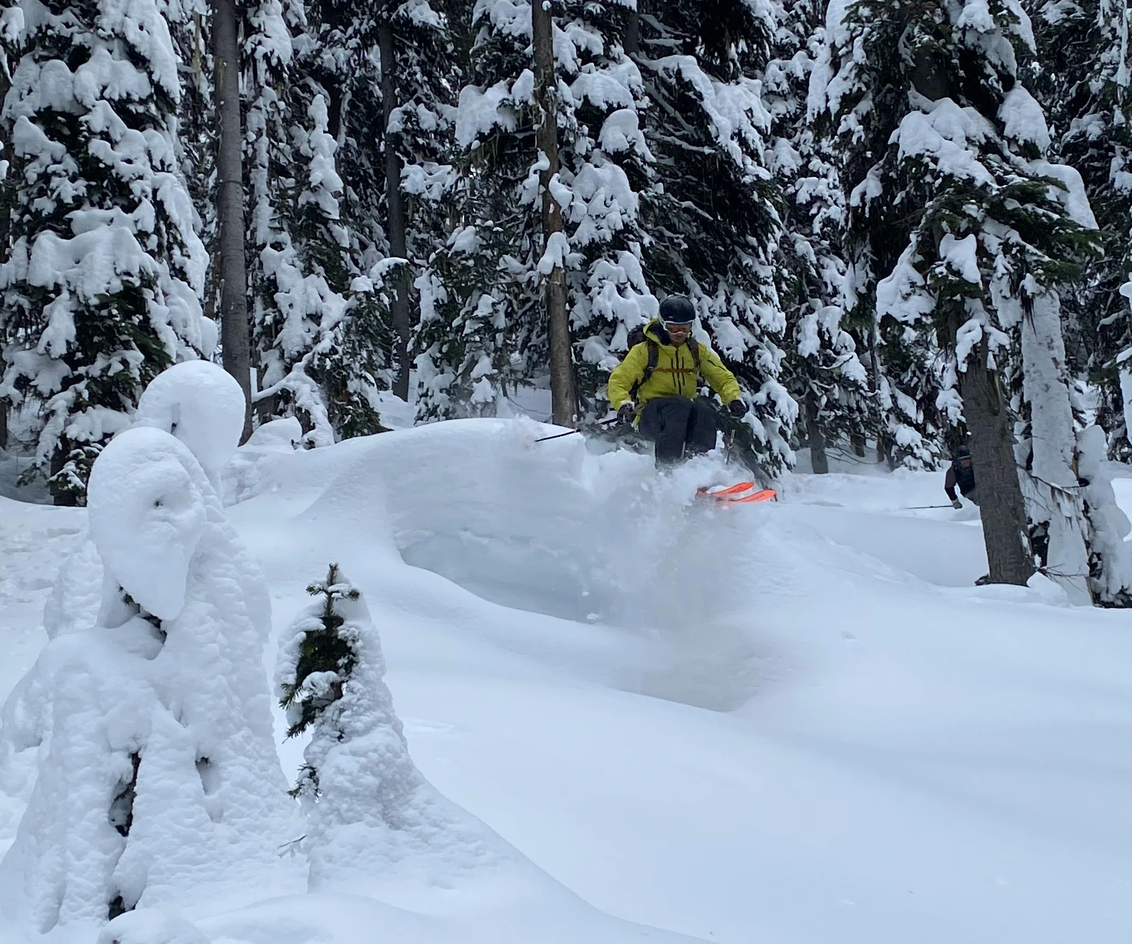 A backcountry skier gets air off of a pillow, Rogers Pass
